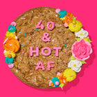 Specialty birthday cookie cake decorated with colorful frosting, sprinkles, and bold pink lettering that reads