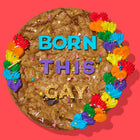 Rainbow-decorated gourmet cookie cake with colorful frosting, sprinkles, and bold lettering spelling out