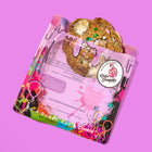 Specialty lactation cookie with a vanilla birthday cake flavor, packed with chocolate, marshmallows, and sprinkles, in vibrant packaging.