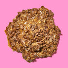 Gourmet oatmeal lactation cookie topped with crispy chocolate cereal and a gooey caramelized glaze.