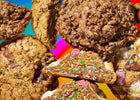 Specialty cookies delivery featuring an assortment of gourmet cookies with melted chocolate, sprinkles, and crispy cereal toppings.