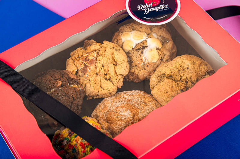 A pink Rebel Daughter Cookies delivery box showing 6 cookies