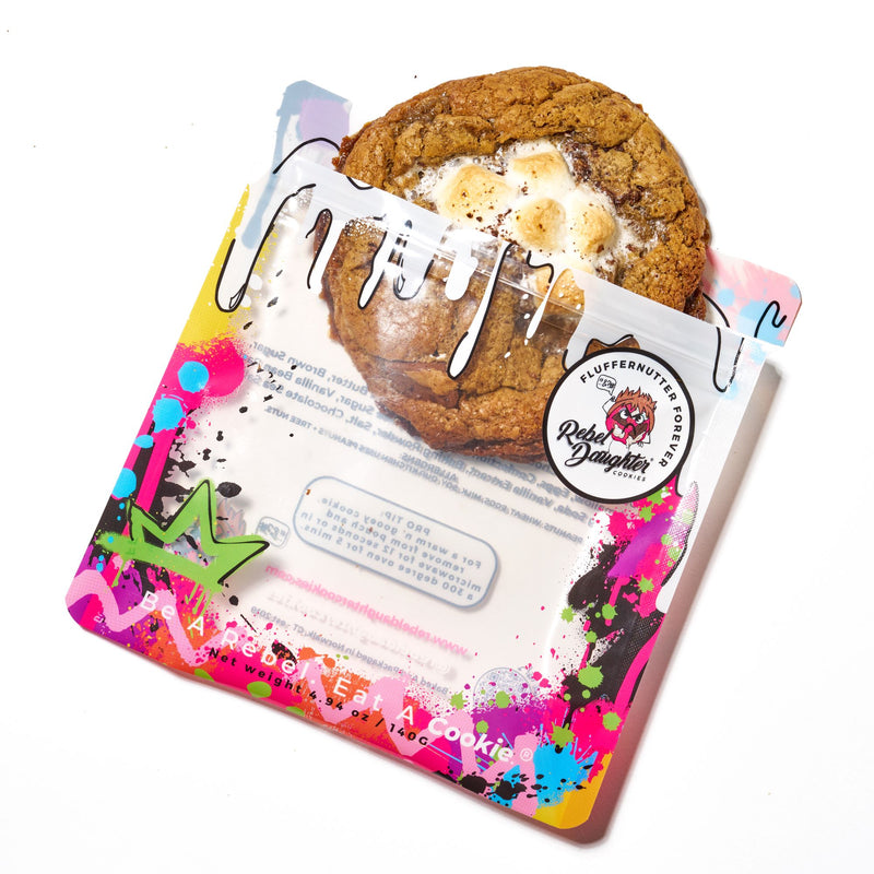 Peanut butter marshmallow cookie gift featuring a packaged cookie with toasted marshmallows and vibrant graffiti-style packaging on a white background.