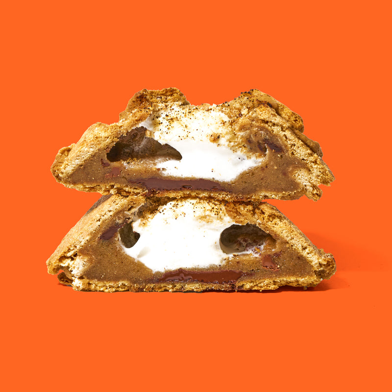 Specialty s'mores cookie with a gooey toasted marshmallow center, melted chocolate, and a graham cracker-infused dough.