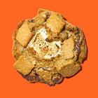 Gourmet s'mores cookie with a hand-toasted marshmallow center, melty chocolate chunks, and a crisp graham cracker crust.