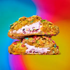 Fruity cereal white chocolate decadent cookies with a gooey, colorful filling and crunchy cereal coating on a vibrant rainbow background.