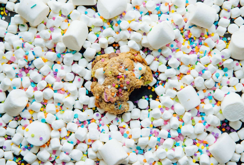 A Rebel Daughter Cookies Birthday Suit oatmeal lactation cookie surrounded by marshmallows and sprinkles