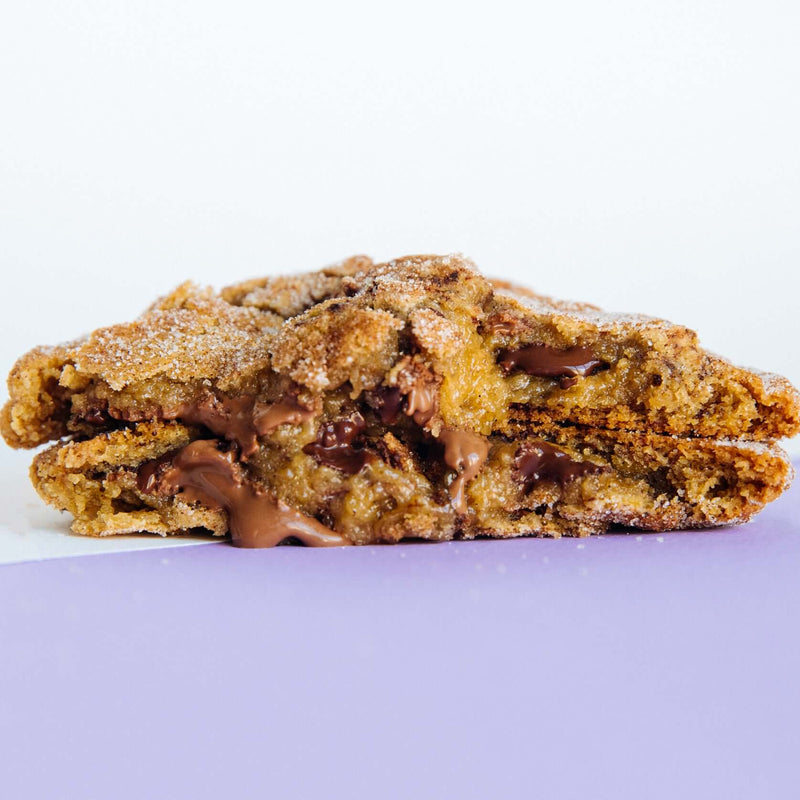 A Rebel Daughter cinnamon sugar chocolate chunk Churro cookie in half and stacked