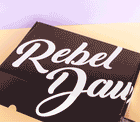 A gif of a black and pink Rebel Daughter Cookies shipping box opening and closing